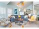 Relax in this spacious living room with comfortable seating and access to the kitchen at 7536 Palm Island S Dr # 1522, Placida, FL 33946