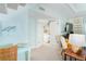 Cozy living room with coastal decor, adjacent bedroom, and bright, natural light at 7536 Palm Island S Dr # 1522, Placida, FL 33946