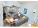 Inviting living room with a high ceiling, a spacious sectional sofa, and access to an outdoor patio at 7536 Palm Island S Dr # 1522, Placida, FL 33946