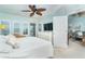 Airy and open main bedroom with ceiling fan, balcony access, and calming color palette at 7536 Palm Island S Dr # 1522, Placida, FL 33946