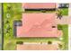 Aerial view of a well-maintained home with a screened-in lanai and lush landscaping on a sunny day at 7620 Raptor Ct, North Port, FL 34287