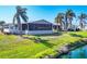 Charming home with a screened lanai, mature palm trees, and views of the nearby community lake at 809 Tangerine Woods Blvd # 215, Englewood, FL 34223