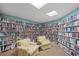 Community library with extensive bookshelves and comfortable seating area at 809 Tangerine Woods Blvd # 215, Englewood, FL 34223