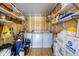 Storage room featuring laundry machines, shelving, and ample storage space at 809 Tangerine Woods Blvd # 215, Englewood, FL 34223