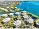 Stunning aerial view of waterfront condos with beautiful landscaping and access to the bay and intercoastal waterway at 11000 Placida Rd # 2702, Placida, FL 33946