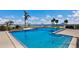 Community pool with clear blue water and plenty of space to lounge and enjoy the Florida sunshine at 11000 Placida Rd # 2702, Placida, FL 33946