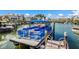 Beautiful condo complex featuring boat slips and a passenger ferry in a serene waterfront setting at 11000 Placida Rd # 2702, Placida, FL 33946