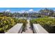 Dock and waterfront view, showcasing waterfront residences and lush landscaping at 11000 Placida Rd # 2702, Placida, FL 33946