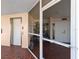 Inviting condo entrance featuring brick flooring, a secure door, and a convenient elevator at 11000 Placida Rd # 2702, Placida, FL 33946