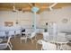 Well-equipped communal kitchen area with tables, seating, and plenty of counter space at 11000 Placida Rd # 2702, Placida, FL 33946
