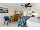 Spacious bedroom with a decorative bed frame and a view of the interior study area at 11000 Placida Rd # 2702, Placida, FL 33946