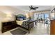 Serene primary bedroom featuring a decorative bed frame and an outdoor balcony with ocean views at 11000 Placida Rd # 2702, Placida, FL 33946