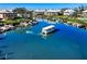 Aerial view of boats navigating the tranquil waters and waterfront homes in this idyllic community at 11000 Placida Rd # 2702, Placida, FL 33946