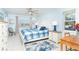 A calming bedroom with a comfy bed, cool ceiling fan, and stylish nautical decor at 130 Sand Dollar Ln, Englewood, FL 34223