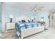 Airy bedroom with a large bed, ceiling fan, and coastal-inspired décor at 130 Sand Dollar Ln, Englewood, FL 34223