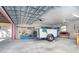Inside a garage with a trailer, a kayak, and tool storage at 130 Sand Dollar Ln, Englewood, FL 34223