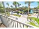 Screened-in porch view of the community, waterfront, and tropical landscaping at 130 Sand Dollar Ln, Englewood, FL 34223