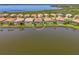 Aerial view of a lakefront home, highlighted for sale at 13000 N Marsh Dr, Port Charlotte, FL 33953