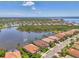 Beautiful aerial shot of lakefront homes, some with private pools, in a lush tropical setting at 13000 N Marsh Dr, Port Charlotte, FL 33953