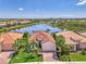 An aerial view of a house with a lake in the background in a beautiful, planned community at 13000 N Marsh Dr, Port Charlotte, FL 33953