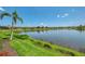 Green lawn leads to a serene lake at 13000 N Marsh Dr, Port Charlotte, FL 33953