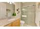 Comfortable bathroom features granite countertops, a walk-in shower, and tile flooring at 13000 N Marsh Dr, Port Charlotte, FL 33953