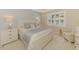 Serene bedroom with soft colors, plush bedding, and a lovely view at 13000 N Marsh Dr, Port Charlotte, FL 33953