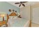 Cozy bedroom features a wooden bed, coastal-themed decor, and ample natural light for relaxed living at 13000 N Marsh Dr, Port Charlotte, FL 33953