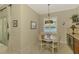 Cozy breakfast nook with a view, stylish lighting, and convenient beverage center at 13000 N Marsh Dr, Port Charlotte, FL 33953