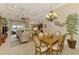 Open-concept living space with dining area and views of the living room and lanai at 13000 N Marsh Dr, Port Charlotte, FL 33953