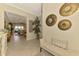 Inviting foyer with decorative tile floors, accent furniture, and a view of the living room at 13000 N Marsh Dr, Port Charlotte, FL 33953