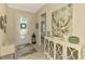 Inviting foyer with decorative tile floors, accent furniture, and a view of the entry door at 13000 N Marsh Dr, Port Charlotte, FL 33953