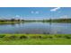 Scenic view of the calm lake from the property at 13000 N Marsh Dr, Port Charlotte, FL 33953
