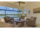 Screened-in patio overlooking a lake with comfortable seating at 13000 N Marsh Dr, Port Charlotte, FL 33953