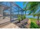 Screened lanai and pool area with a view of the lake at 13000 N Marsh Dr, Port Charlotte, FL 33953