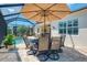 A beautiful screened-in outdoor pool area with nice patio furniture at 13000 N Marsh Dr, Port Charlotte, FL 33953