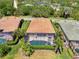 An aerial view of the home showcasing its pool, spa, and proximity to a lush landscape at 13217 Scrub Jay Ct, Port Charlotte, FL 33953