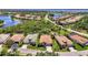 Expansive aerial view of a residential community with waterfront access and meticulously maintained landscapes at 13217 Scrub Jay Ct, Port Charlotte, FL 33953