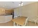 Cozy dining area adjacent to the kitchen, featuring a wood table and neutral decor at 13217 Scrub Jay Ct, Port Charlotte, FL 33953