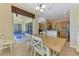 Open dining area with views of the screened lanai, connecting indoor and outdoor living at 13217 Scrub Jay Ct, Port Charlotte, FL 33953