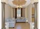 Living room features decorative columns and a chandelier at 13217 Scrub Jay Ct, Port Charlotte, FL 33953