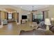 Large living room with tile floors, neutral walls, ceiling fans, and lots of natural light at 13217 Scrub Jay Ct, Port Charlotte, FL 33953