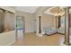 Open-concept living area featuring tile flooring, decorative pillars, and elegant furnishings at 13217 Scrub Jay Ct, Port Charlotte, FL 33953