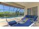 Enjoy the outdoors with this covered pool, lounge chairs, and comfortable seating at 13217 Scrub Jay Ct, Port Charlotte, FL 33953