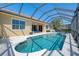 Enjoy the sparkling pool and relaxing spa, enclosed for privacy and relaxation at 13217 Scrub Jay Ct, Port Charlotte, FL 33953