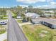 A view showing the home's location and neighborhood, with a long driveway and attached garage at 1365 Sussex Rd, Venice, FL 34293