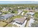 Aerial view of the property showcasing its prime location in a peaceful residential neighborhood near the coastline at 1365 Sussex Rd, Venice, FL 34293