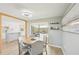 Bright dining area with a backyard view and access, seamlessly connects to the kitchen at 1365 Sussex Rd, Venice, FL 34293