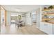 Cozy dining room with modern furnishings, sliding door access, and built in shelves at 1365 Sussex Rd, Venice, FL 34293