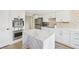 Beautiful kitchen with a marble island, stainless steel appliances, and modern finishes at 1365 Sussex Rd, Venice, FL 34293